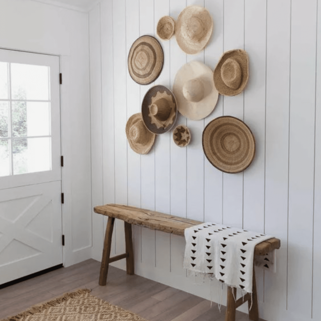 summer decor straw hats on wall