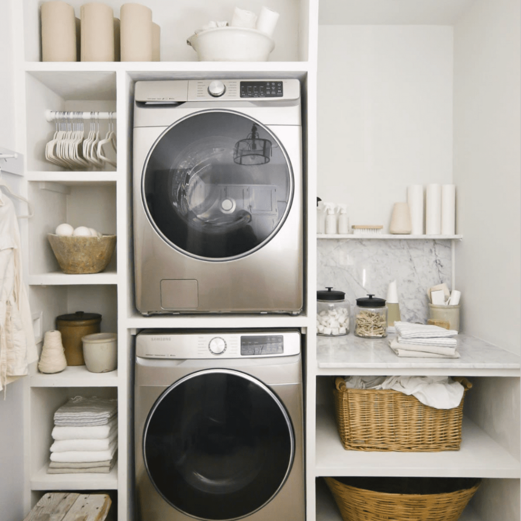 Stacked Laundry Room with woven baskets and laundry room essentials